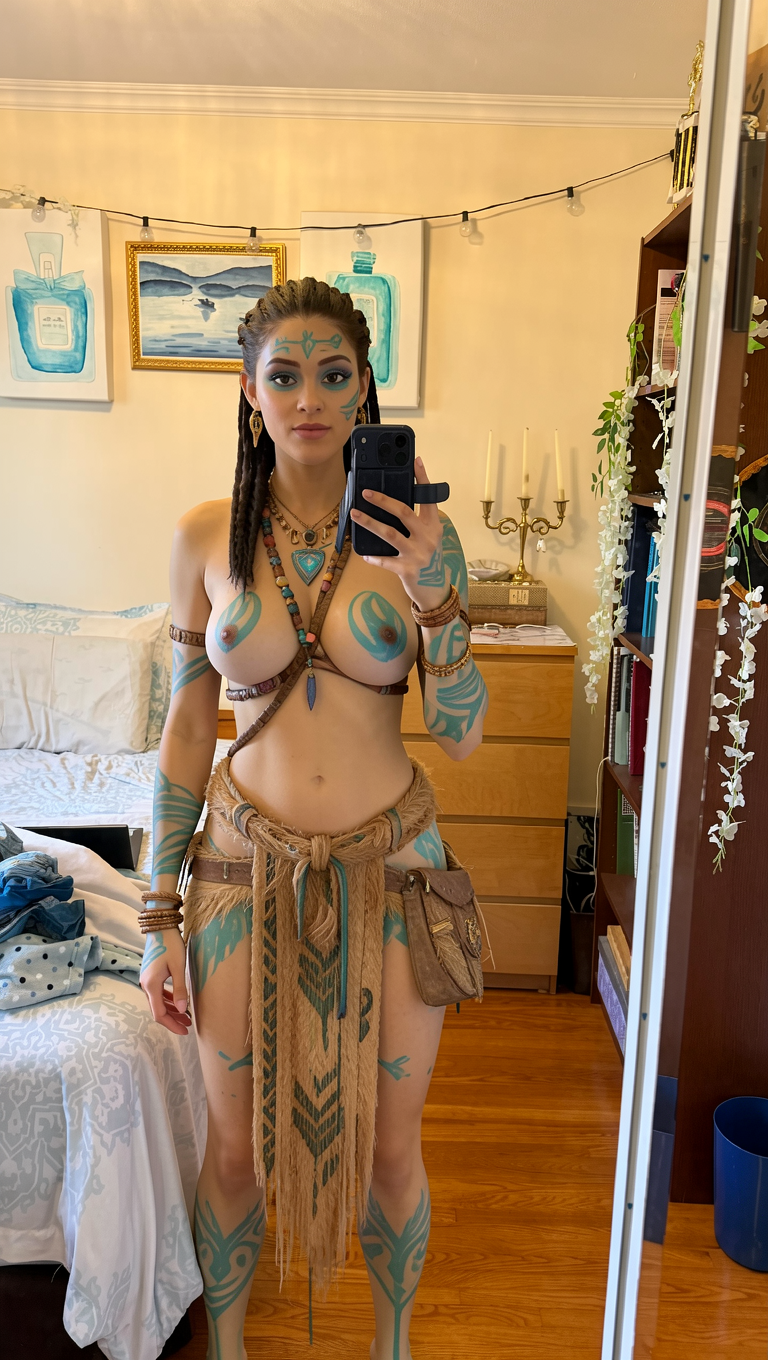 Turn her into a navi'i-looking character from James Cameron's Avatar. Keep her face shape the same